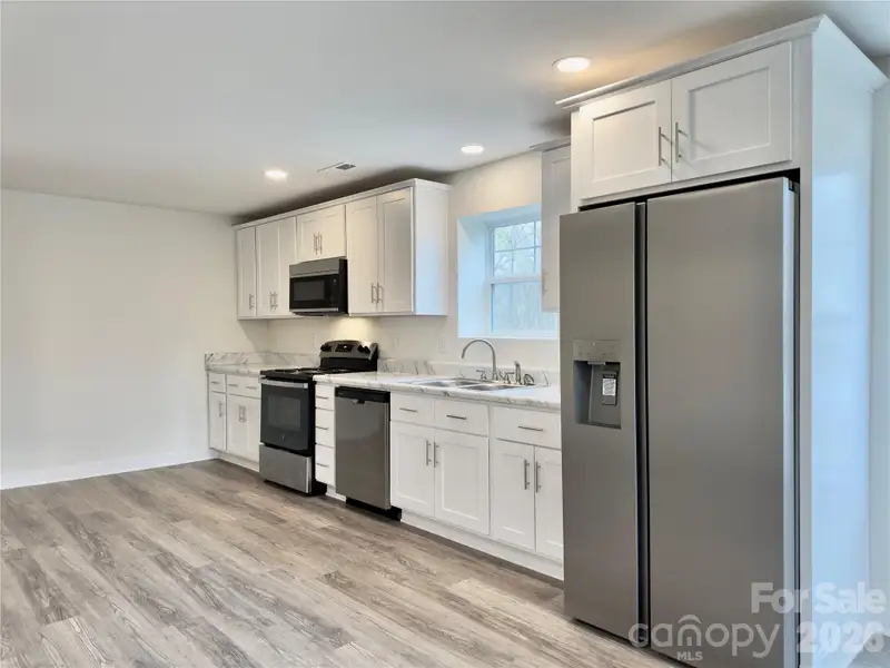 Furnished interior view inside a new home in , Oakboro (Image 3).