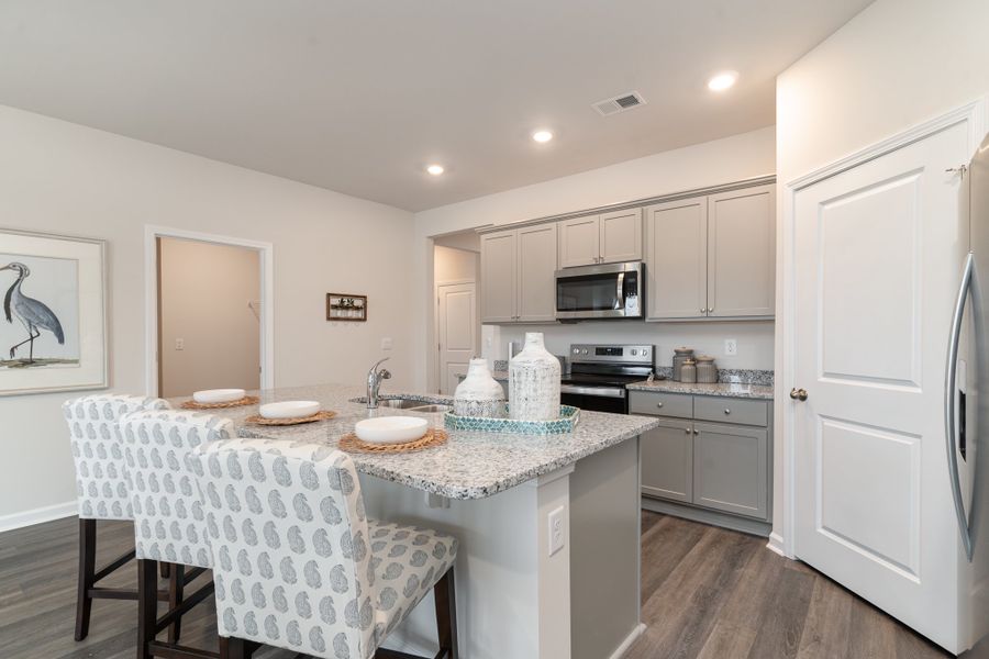 Representative furnished interior of a home built from the DOVER by D.R. Horton in Kingston Bay, Conway (Image 14).