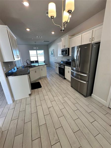 Furnished interior view inside a new home in Abbey Glen, Dade City (Image 7).