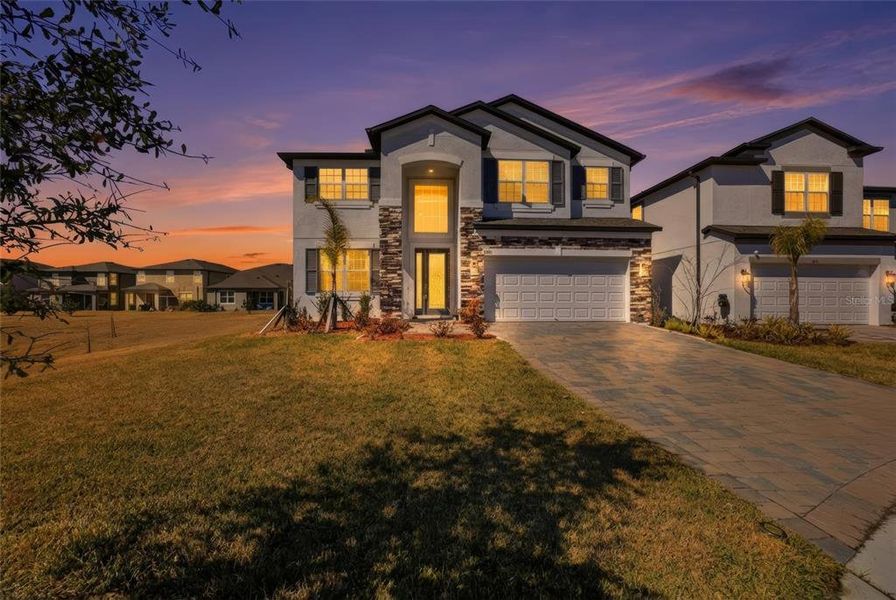 Front exterior of a new home in , Zephyrhills, FL, highlighting curb appeal (Image 24).