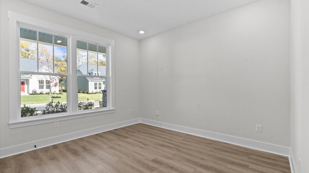 Elegant hardwood floors extend into spacious, light-filled secondary bedrooms Elegant hardwood floors extend into spacious, light-filled secondary bedrooms