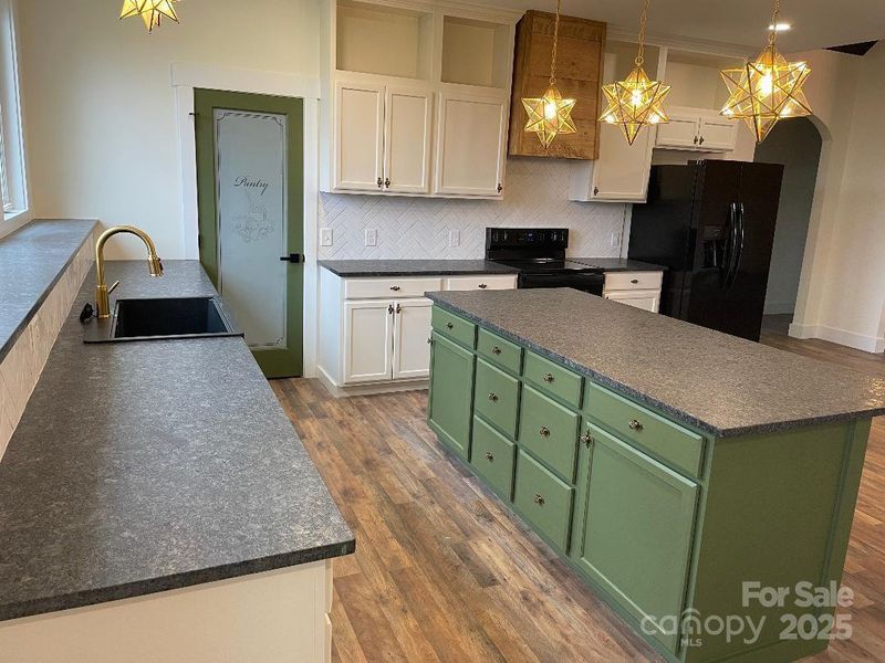 Kitchen prep space and island with storage