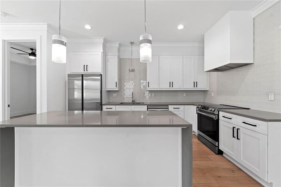 Stainless steel appliances, granite countertops with waterfall edge...all the bells and whistles!