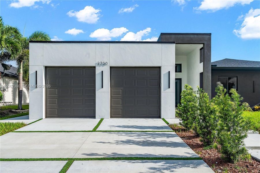 Front exterior of a new home in , Cape Coral, FL, highlighting curb appeal (Image 24). Front exterior of a new home in , Cape Coral, FL, highlighting curb appeal (Image 24).