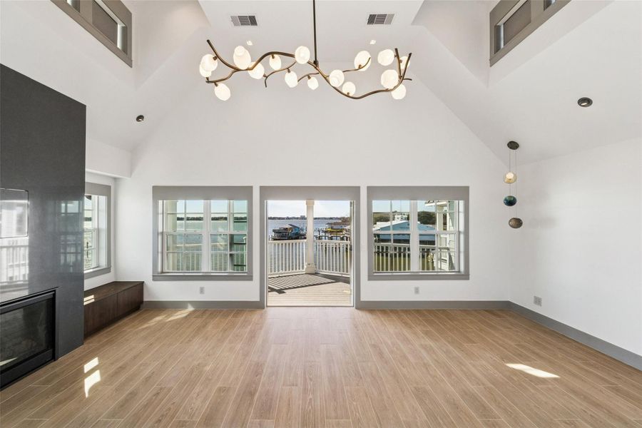 Primary suite has fireplace, dry bar and balcony.