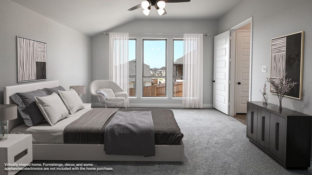 Bedroom featuring baseboards, lofted ceiling, carpet floors, and a ceiling fan Bedroom featuring baseboards, lofted ceiling, carpet floors, and a ceiling fan