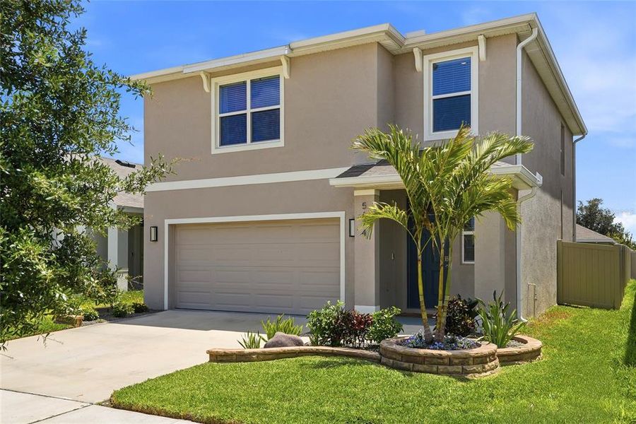 Front exterior of a new home in , Wesley Chapel, FL, highlighting curb appeal (Image 23).