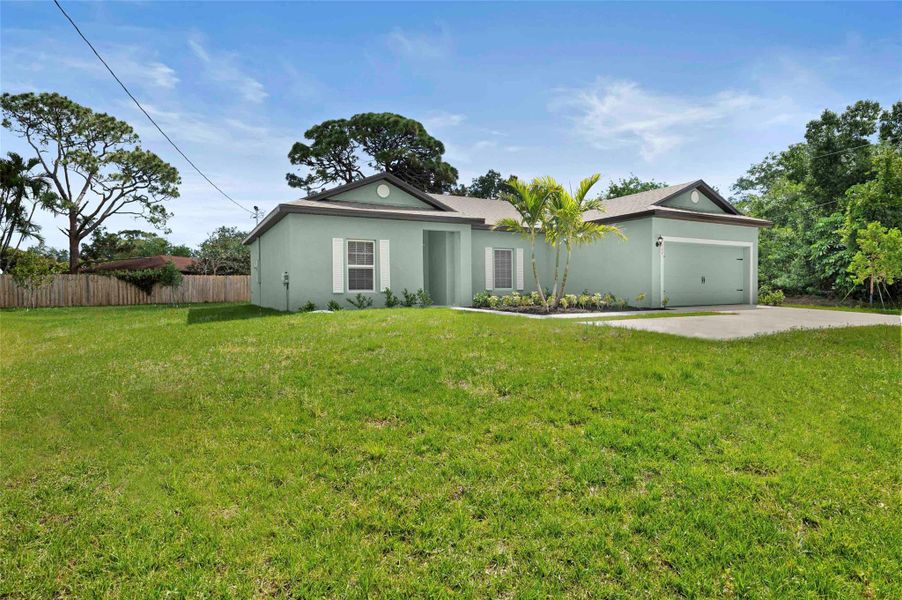 Front exterior of a new home in , Port St. Lucie, FL, highlighting curb appeal (Image 12). Front exterior of a new home in , Port St. Lucie, FL, highlighting curb appeal (Image 12).