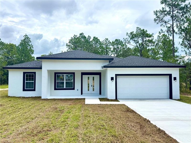 Front exterior of a new home in , Citrus Springs, FL, highlighting curb appeal (Image 2). Front exterior of a new home in , Citrus Springs, FL, highlighting curb appeal (Image 2).
