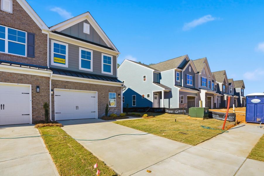Front exterior of a new home in Blythe Mill Townhomes, Waxhaw, NC, highlighting curb appeal (Image 23). Front exterior of a new home in Blythe Mill Townhomes, Waxhaw, NC, highlighting curb appeal (Image 23).