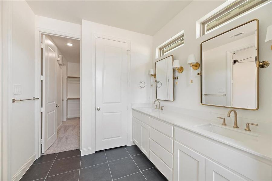 Bathroom with vanity and tile patterned floors