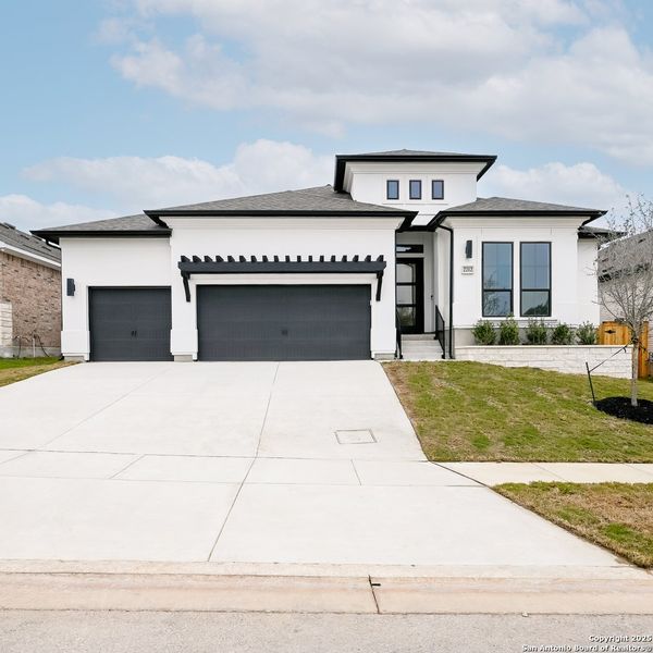 Front exterior of a new home in Veramendi 60', New Braunfels, TX, highlighting curb appeal (Image 26).