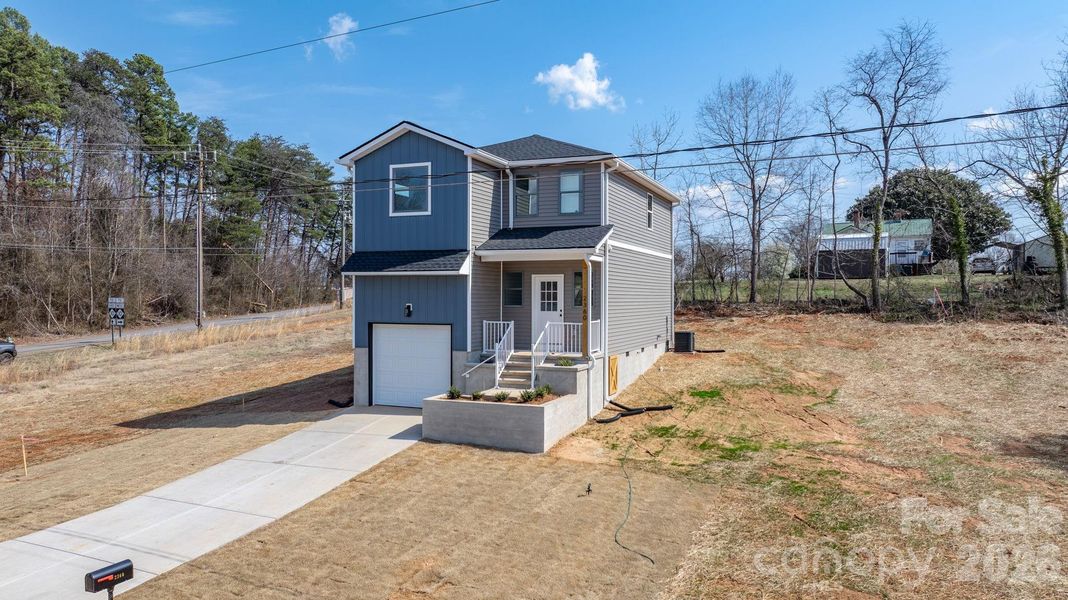 Front exterior of a new home in , Catawba, NC, highlighting curb appeal (Image 26).