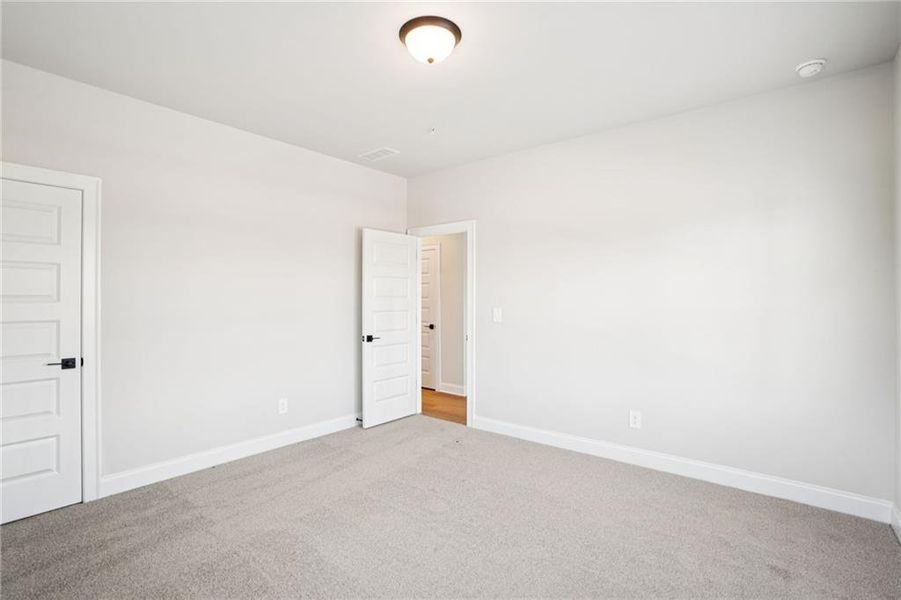 Spacious, unfurnished interior of a new home in Hemingway - Highland Series, Cumming (Image 33).