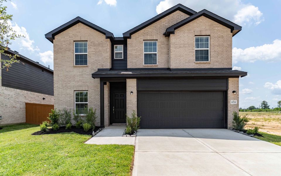 Front exterior of a new home in Cypress Green, Hockley, TX, highlighting curb appeal (Image 1). Front exterior of a new home in Cypress Green, Hockley, TX, highlighting curb appeal (Image 1).