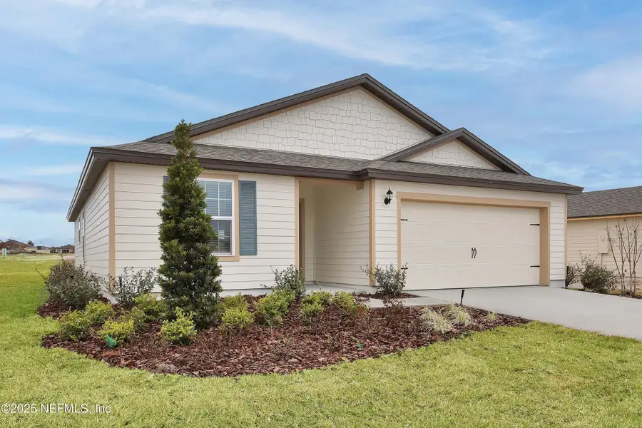 Front exterior of a new home in Rolling Hills, Green Cove Springs, FL, highlighting curb appeal (Image 1).