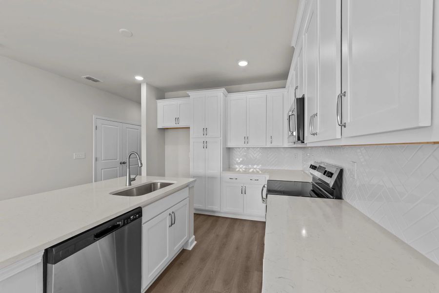 Furnished interior view inside a new home in Blue Heron Retreat: Villas, Little River (Image 10).