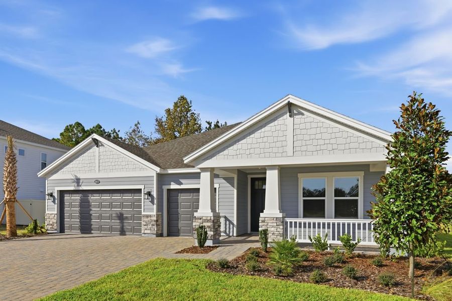 Front exterior of a new home in Headwaters at Lofton Creek, Yulee, FL, highlighting curb appeal (Image 2).