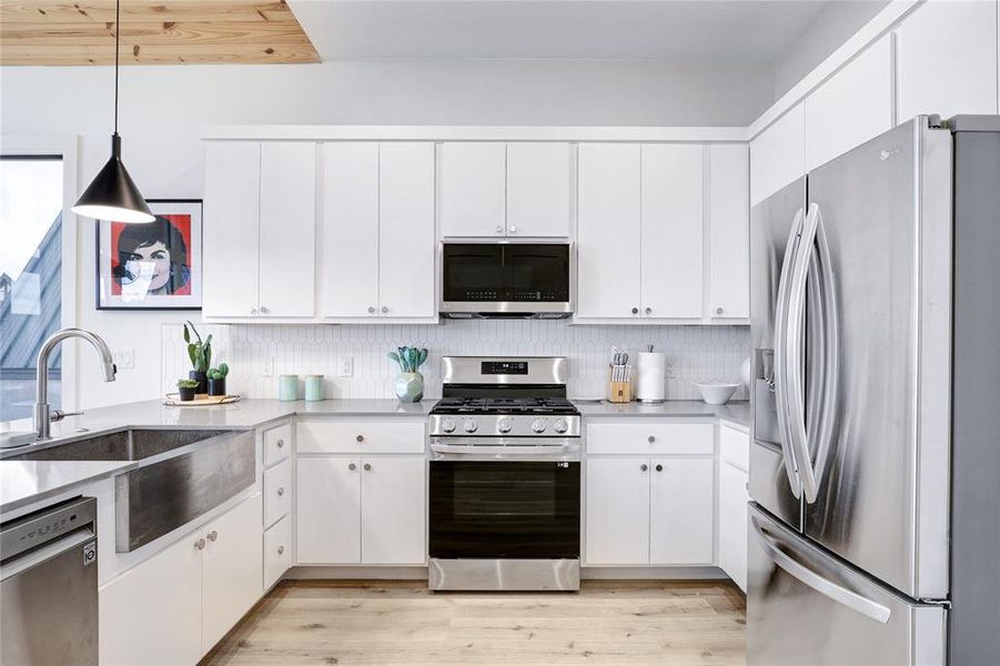 This well designed kitchen seamlessly blends with the family room, perfect for modern living and entertaining.