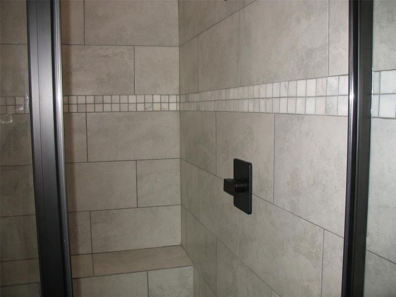 Bathroom view of tiled shower