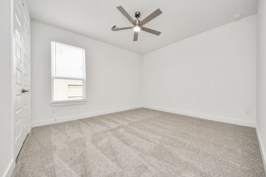 Secondary bedroom features plush carpeting, large windows that let in plenty of natural light, bright paint, and spacious closets. Secondary bedroom features plush carpeting, large windows that let in plenty of natural light, bright paint, and spacious closets.