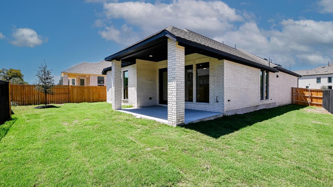 Front exterior of a new home in 6 Creeks 45', Kyle, TX, highlighting curb appeal (Image 19). Front exterior of a new home in 6 Creeks 45', Kyle, TX, highlighting curb appeal (Image 19).