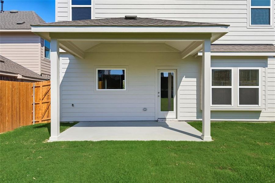 Rear view of property with a patio and roof with shingles Rear view of property with a patio and roof with shingles