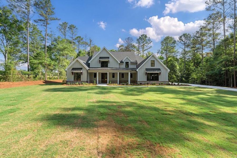 Front exterior of a new home in , Carrollton, GA, highlighting curb appeal (Image 26).