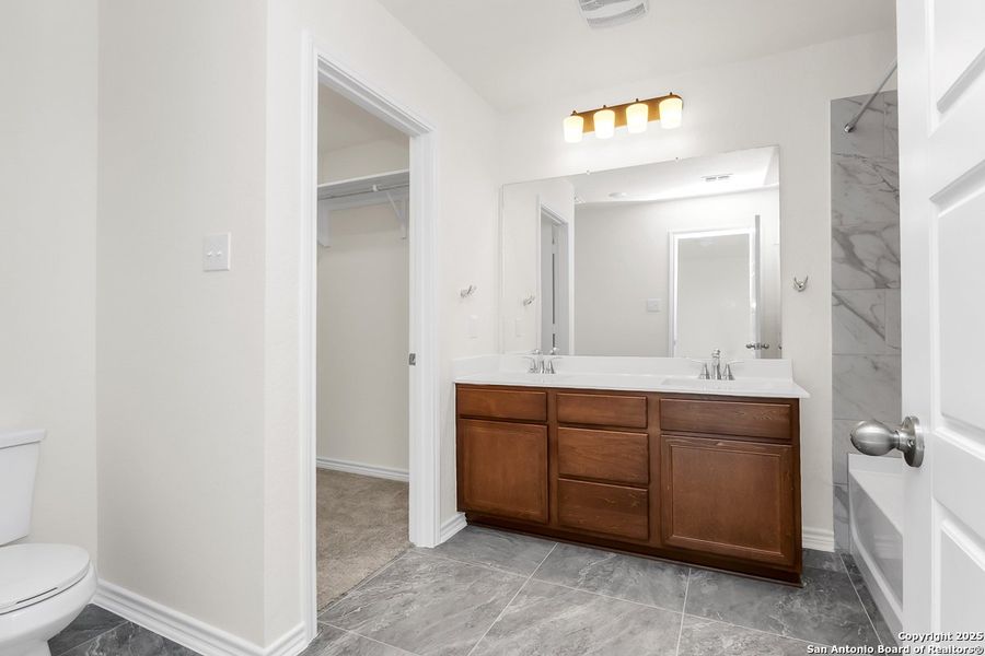 Furnished interior view inside a new home in Spanish Trails Villas, San Antonio (Image 6).