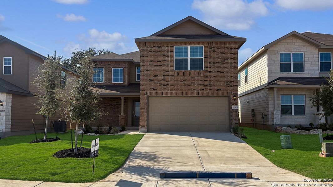 Front exterior of a new home in Langdon, San Antonio, TX, highlighting curb appeal (Image 2). Front exterior of a new home in Langdon, San Antonio, TX, highlighting curb appeal (Image 2).