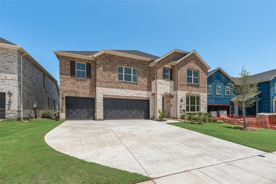 Front exterior of a new home in Valencia On The Lake, Little Elm, TX, highlighting curb appeal (Image 21).