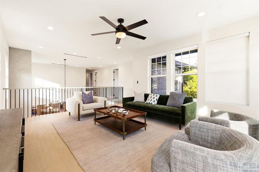Living room with ceiling fan, recessed lighting, and hardwood / wood-style floors