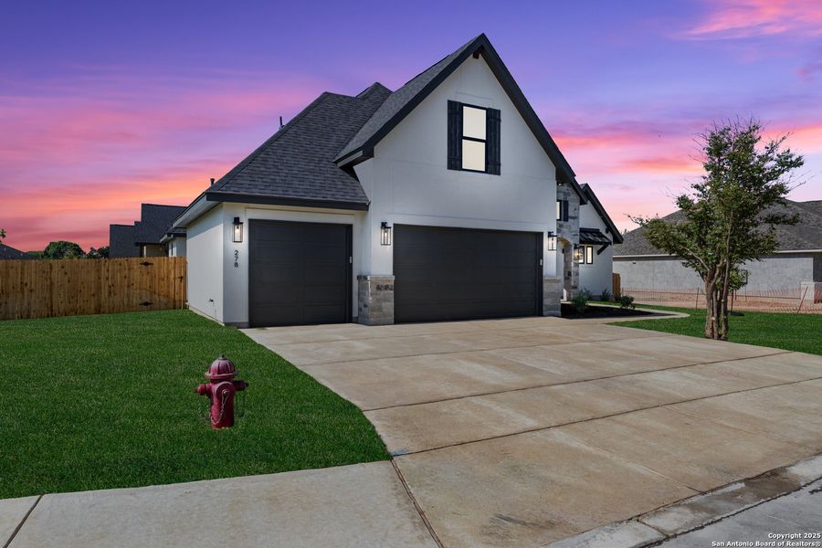 Front exterior of a new home in , Castroville, TX, highlighting curb appeal (Image 24). Front exterior of a new home in , Castroville, TX, highlighting curb appeal (Image 24).