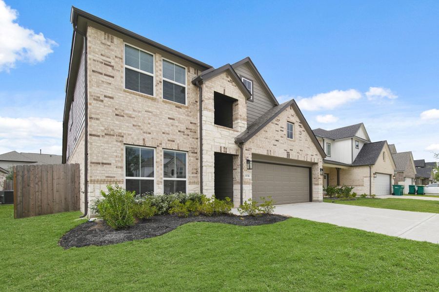Front exterior of a new home in Barton Creek Ranch, Conroe, TX, highlighting curb appeal (Image 13). Front exterior of a new home in Barton Creek Ranch, Conroe, TX, highlighting curb appeal (Image 13).