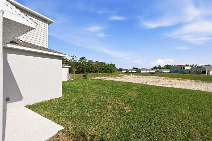 Exterior details and patio area of a home in Palm Wind, Hudson (Image 4).
