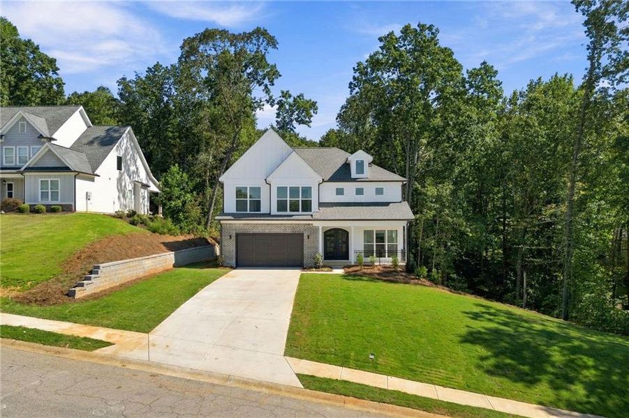 Front exterior of a new home in , Flowery Branch, GA, highlighting curb appeal (Image 27).