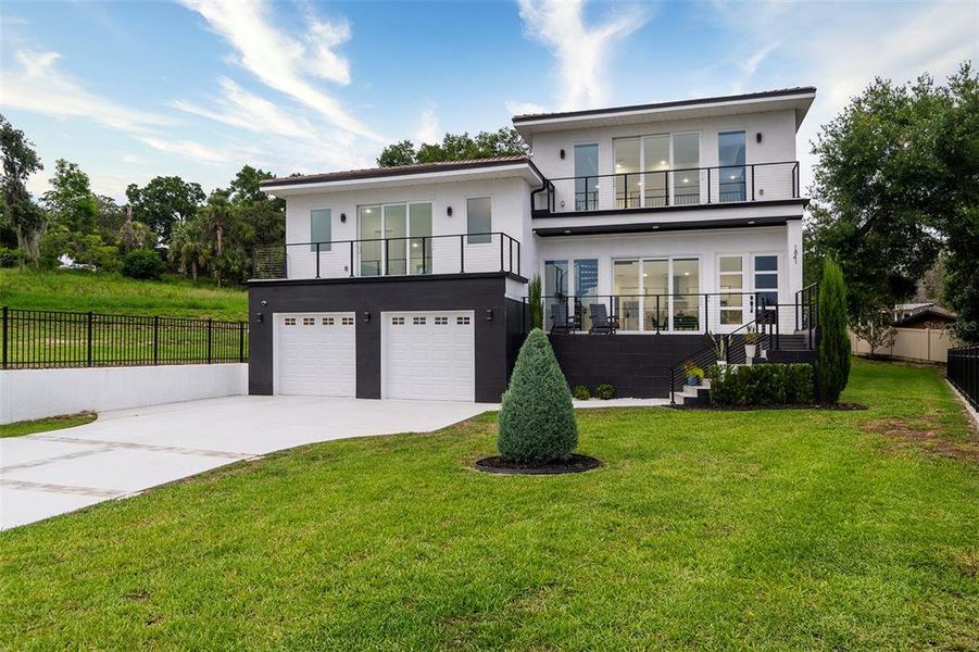 Front exterior of a new home in , Clermont, FL, highlighting curb appeal (Image 32). Front exterior of a new home in , Clermont, FL, highlighting curb appeal (Image 32).