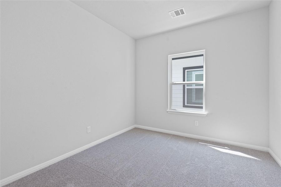 Unfurnished room with carpet