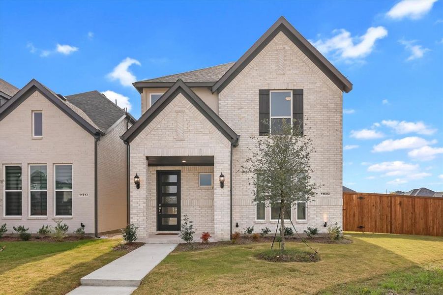 Front exterior of a new home in Symmetry 37s, Frisco, TX, highlighting curb appeal (Image 30).