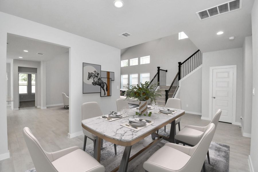Virtually Staged - Dining Room. Sample photo of completed home with similar floor plan. As-built interior colors and selections may vary