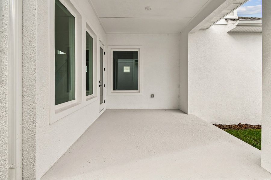 Exterior details and patio area of a home in Emerald Landing at Waterside at Lakewood Ranch – Cottage Series, Sarasota (Image 3).