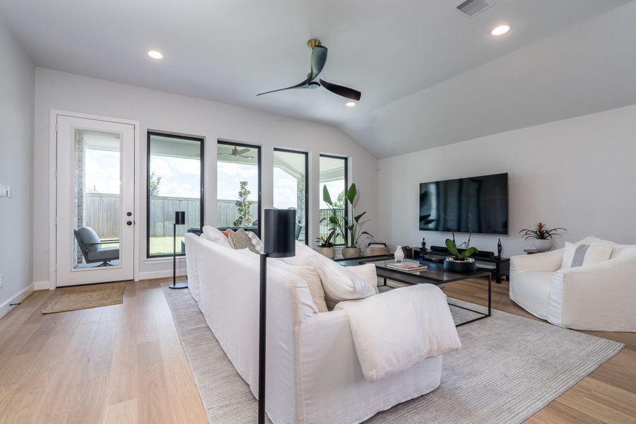 One more photo of the large, but comfortable, family room with continued RevWood flooring and recessed lighting. Television bracket stays with the home. One more photo of the large, but comfortable, family room with continued RevWood flooring and recessed lighting. Television bracket stays with the home.
