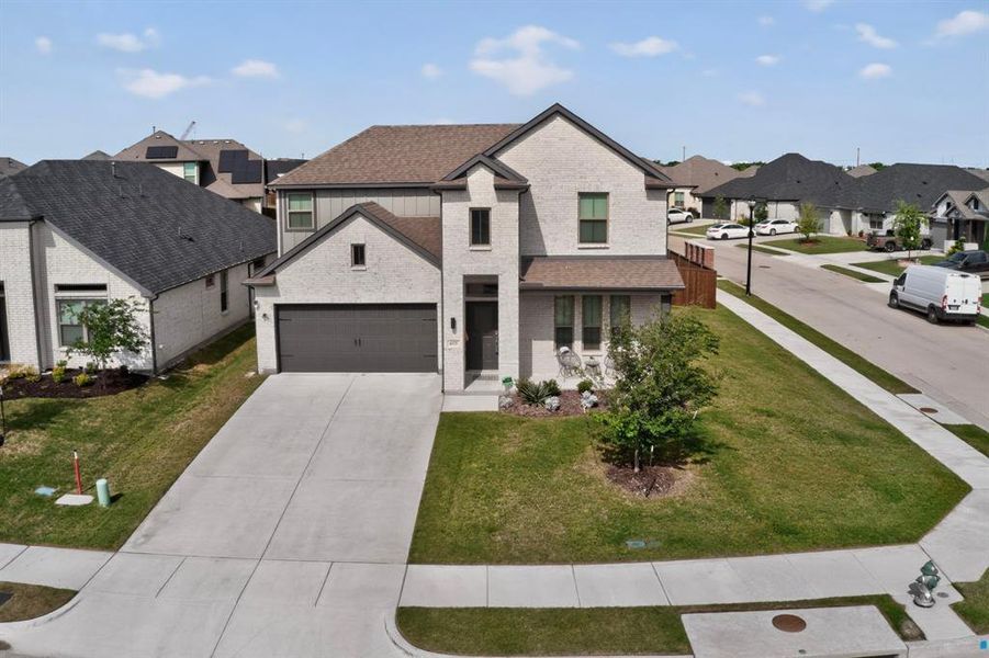 Front exterior of a new home in Oakmont Park, Red Oak, TX, highlighting curb appeal (Image 21). Front exterior of a new home in Oakmont Park, Red Oak, TX, highlighting curb appeal (Image 21).