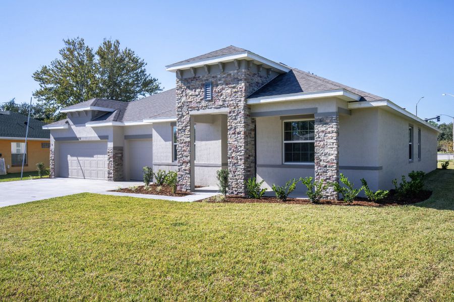 Representative exterior photo of a completed home built from the Livorno by Maronda Homes in Coastal Communities, Edgewater, FL (Image 23).