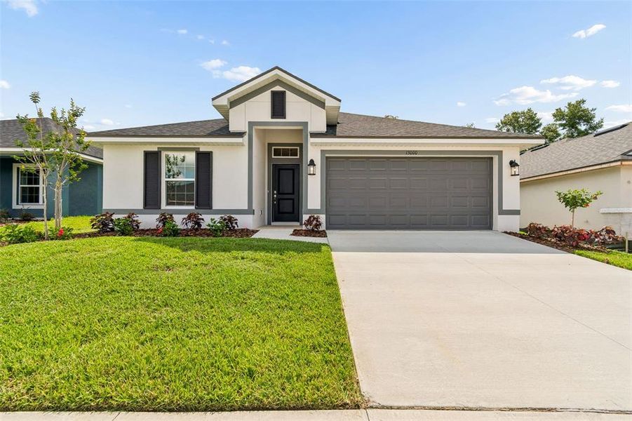 Front exterior of a new home in Abbey Glen, Dade City, FL, highlighting curb appeal (Image 2). Front exterior of a new home in Abbey Glen, Dade City, FL, highlighting curb appeal (Image 2).