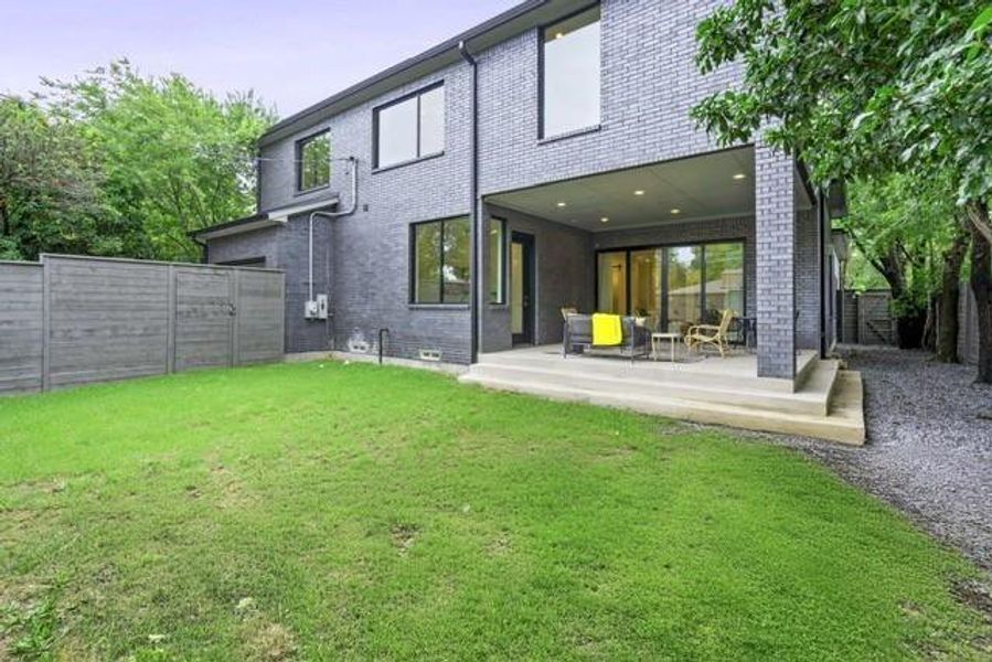 Back of property featuring a patio and brick siding Back of property featuring a patio and brick siding