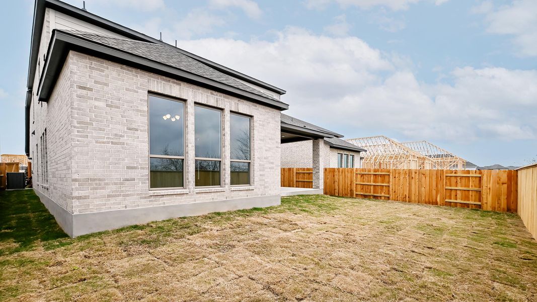 Exterior details and patio area of a home in Crosswinds 50', Kyle (Image 22).