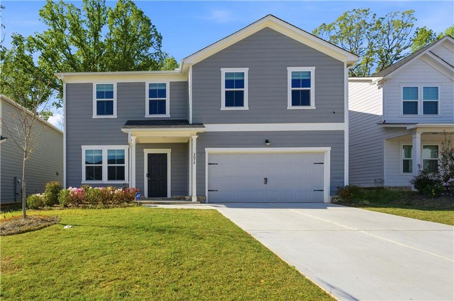 Front exterior of a new home in , Covington, GA, highlighting curb appeal (Image 1). Front exterior of a new home in , Covington, GA, highlighting curb appeal (Image 1).