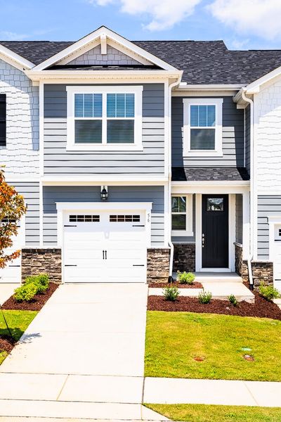 Front exterior of a new home in Vaughan Farms, Angier, NC, highlighting curb appeal (Image 1).