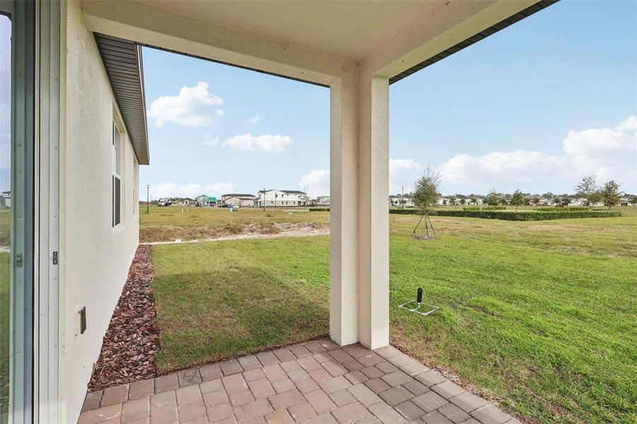 Exterior details and patio area of a home in The Reserve at Twin Lakes, St. Cloud (Image 18).